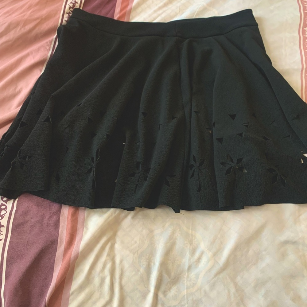 Black mini skirt. Never worn. Approximately 18 inches long